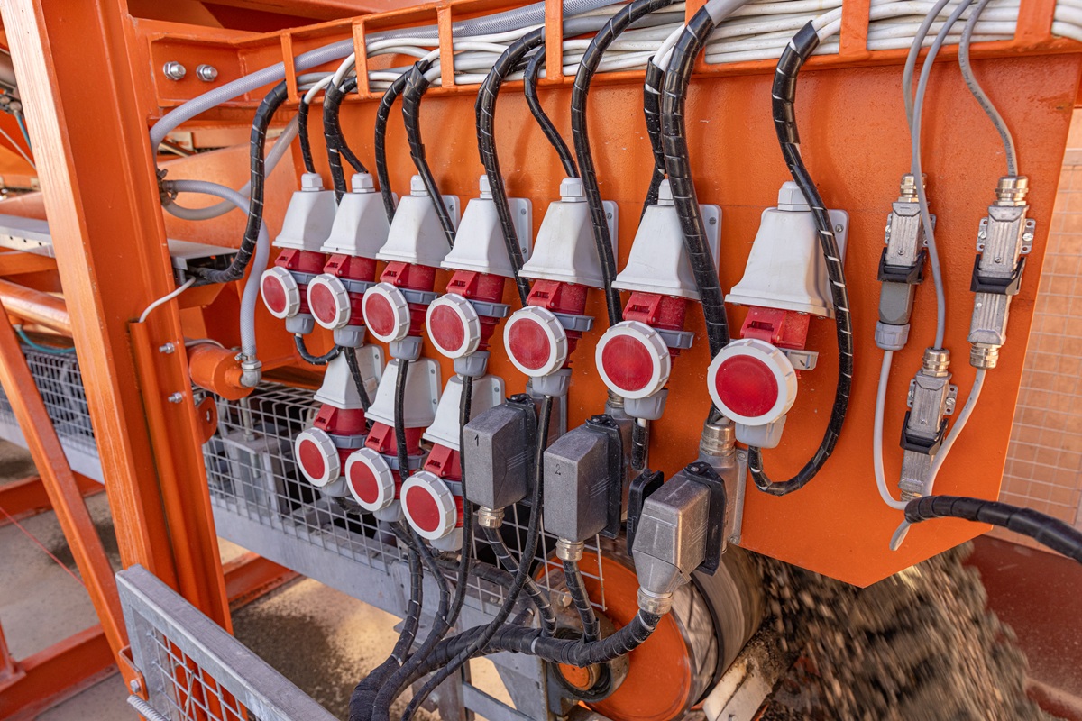 Industrial sockets and plug on distribution board. Construction site electricity, temporary energy supply
